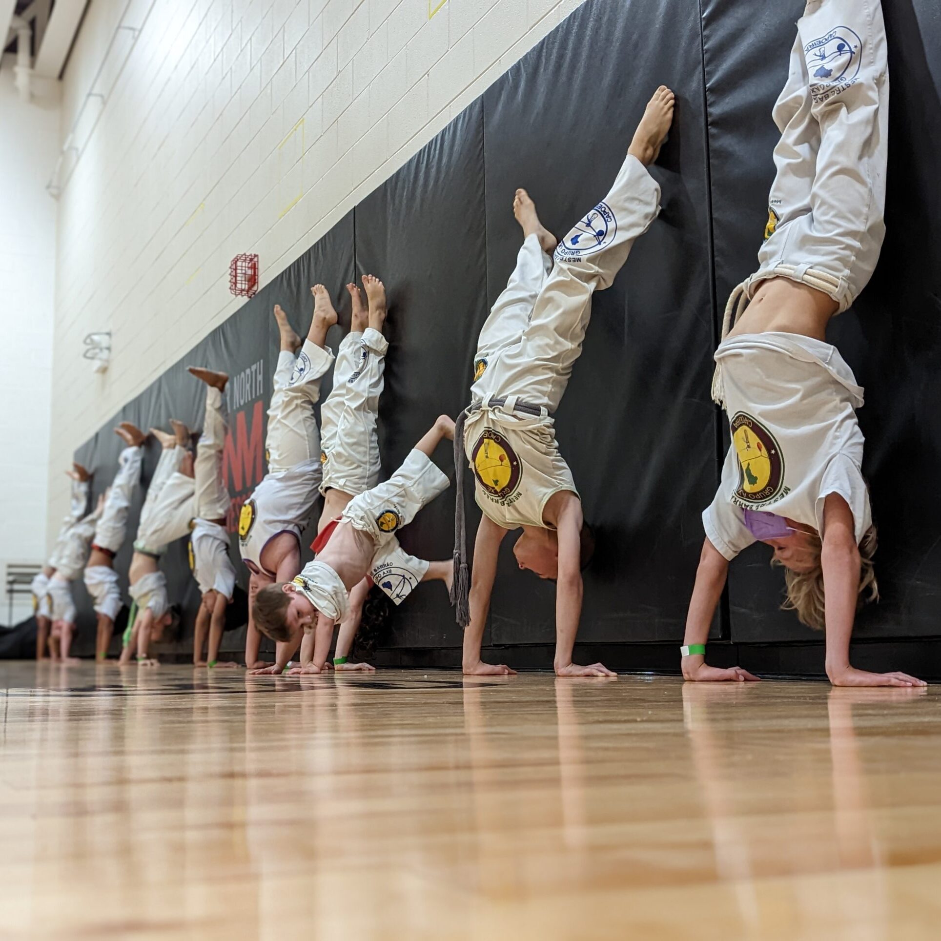 Axé Capoeira Chicago students demonstrating martial arts movement
