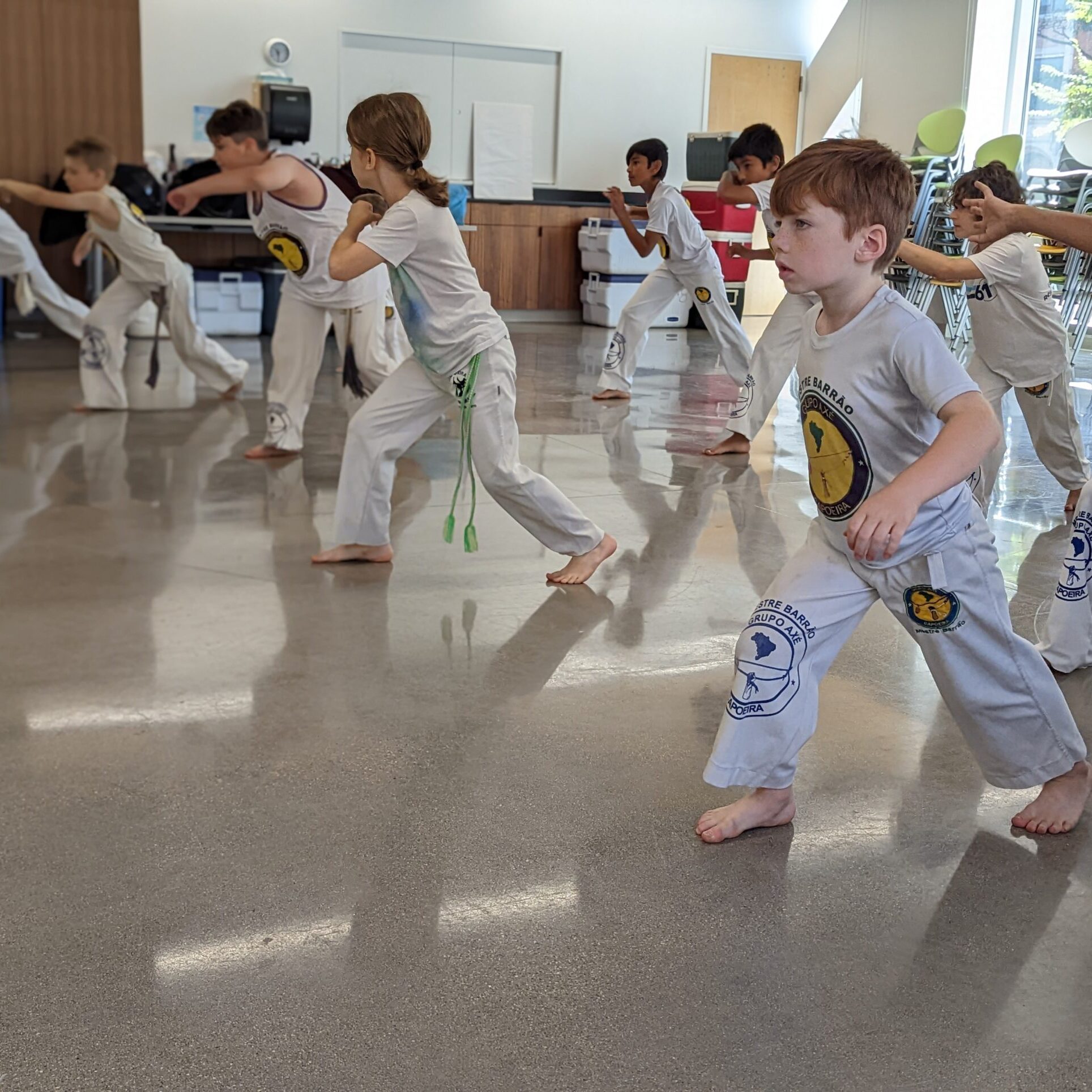 Students and families gathered for a capoeira class at Axé Capoeira Chicago