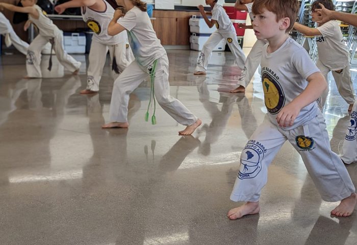 Youth capoeira class in session at Axé Capoeira Chicago